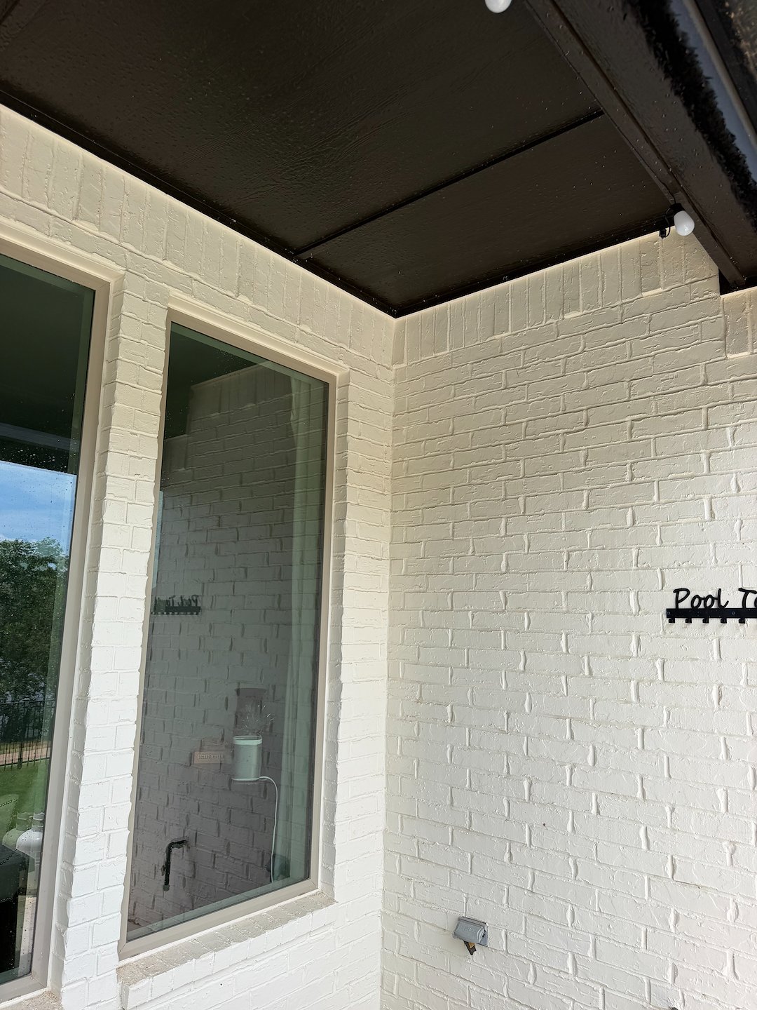 Revitalizing House Wash of painted brick house in Oklahoma City. 